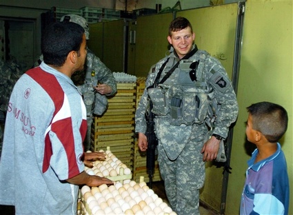 soldier showing eggs to locals